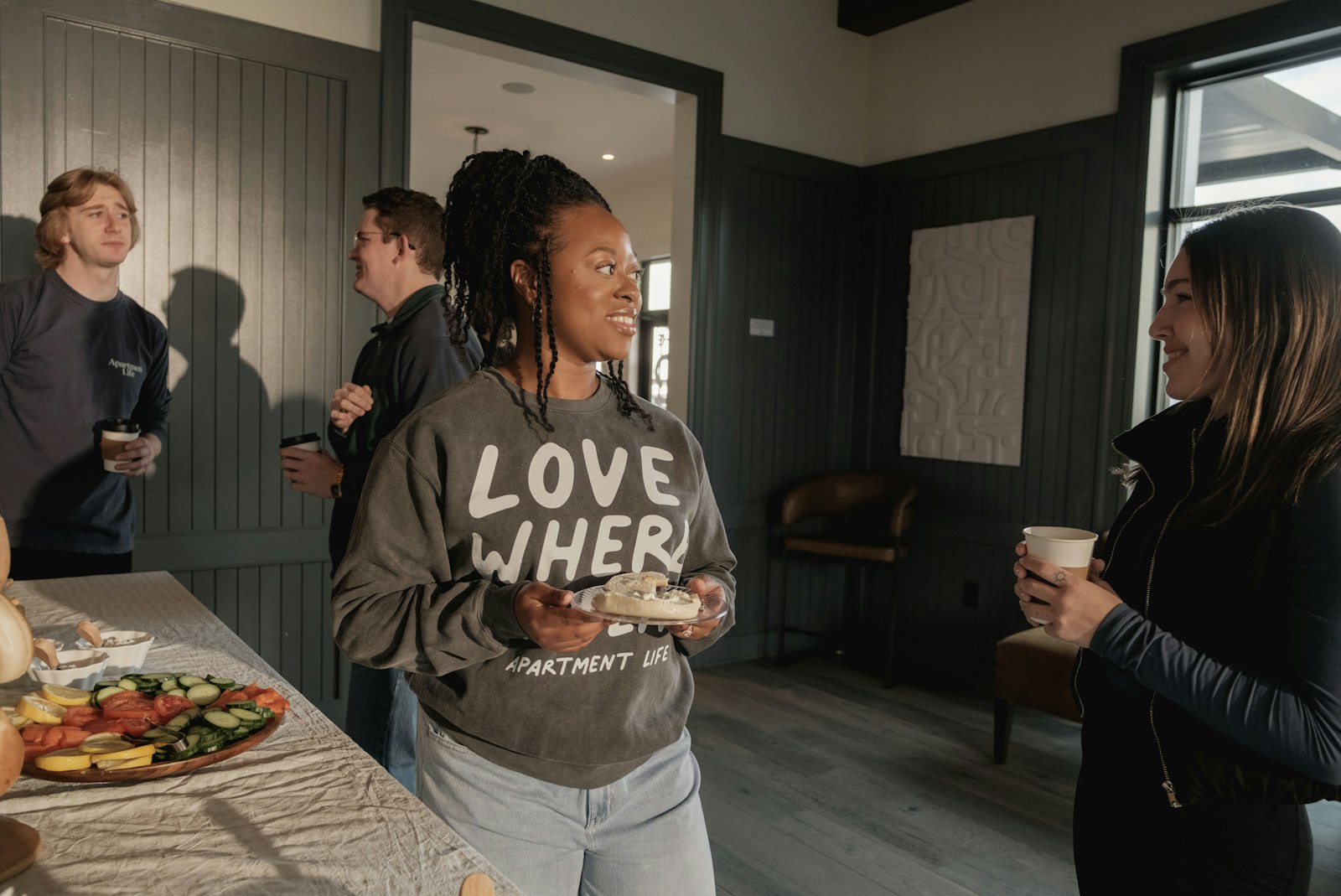 People connecting at a community breakfast gathering
